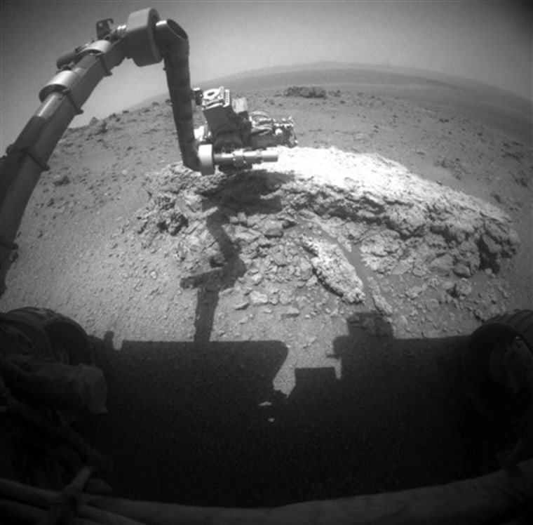 This image shows the Opportunity rover extending its arm toward a light-toned rock called "Tisdale 2" on Aug. 23.